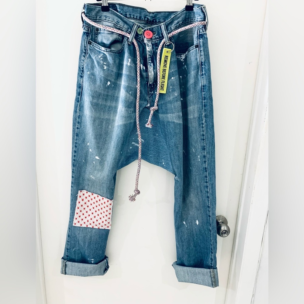 Levi's Distressed Blue Boyfriend Jeans with Pink Accents